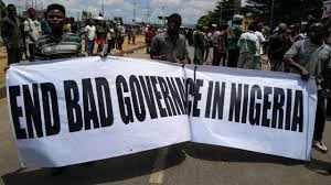 Young Nigerians protesting peacefully on a city street, symbolising youth demands for dialogue and political inclusion