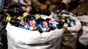NDLEA officers after seizing 1,499 bottles of codeine-based cough syrup from a suspect arrested in Tofa Local Government Area of Kano State.